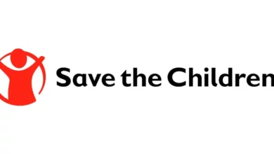 Young professionals collaborating on a global humanitarian project for children, representing Save the Children entry-level jobs.
