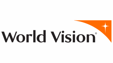 World Vision Home-Based Job 2026 concept showing remote NGO professionals working from home on laptops supporting global humanitarian projects and international development programs.